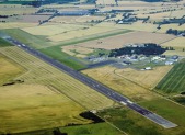 Letiště v Odense na ostrově Fyn. Název města pochází ze slov Odins Vi, tedy Odinovo místo, a odkazuje na severskou mytologii.