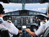 pilots-sit-behind-older-cockpit.jpg